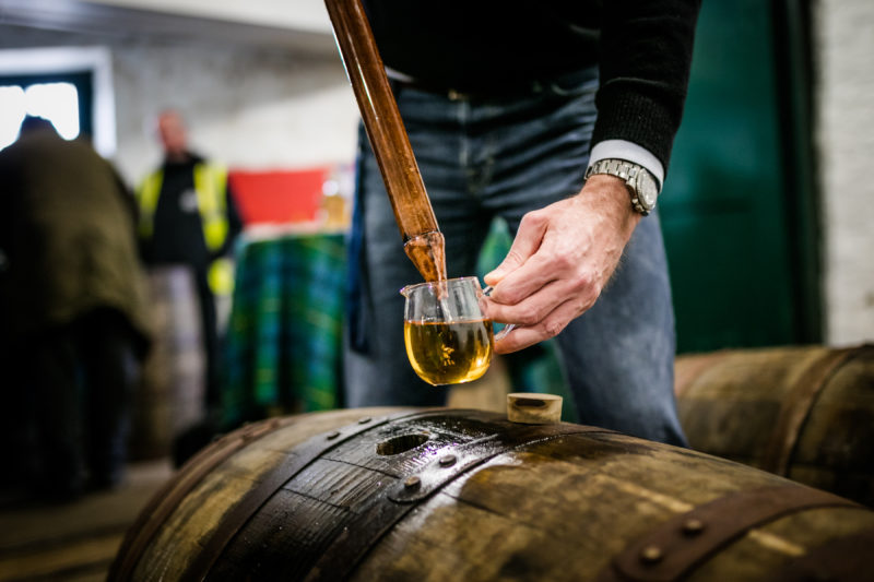 Whisky Sample Being Drawn From A Cask